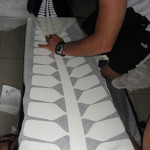 The arduous task of putting our tail ferns on our boats